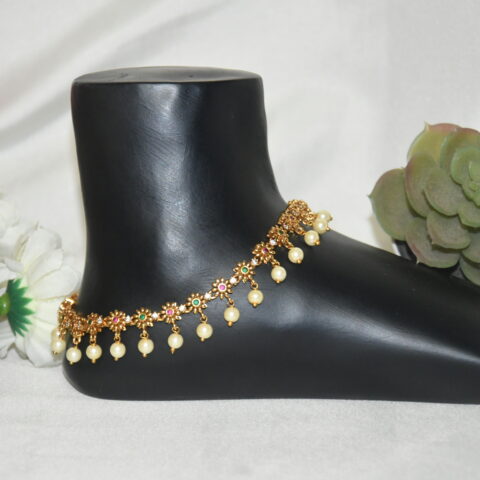 Antique flower pearl hanging anklets with vintage floral motif and pearl drops by Nischala Fashions.