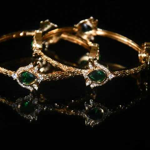 Green lotus 2pc bangles with floral design and traditional gold finish by nischala fashions