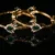 Green lotus 2pc bangles with floral design and traditional gold finish by nischala fashions