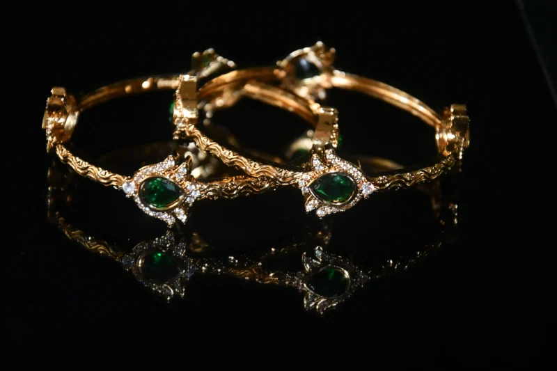 Green lotus 2pc bangles with floral design and traditional gold finish by nischala fashions