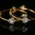 White lotus 2pc bangles with gold finish and floral detailing by nischala fashions