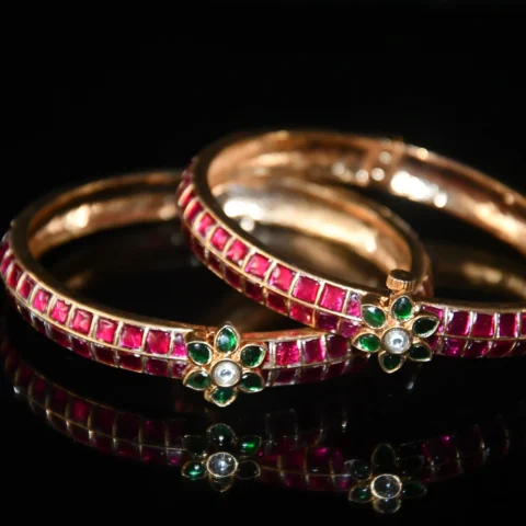 Jadau Kundan 2pc bangles with gold finish and traditional stonework by nischala fashions