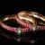 Jadau Kundan 2pc bangles with gold finish and traditional stonework by nischala fashions