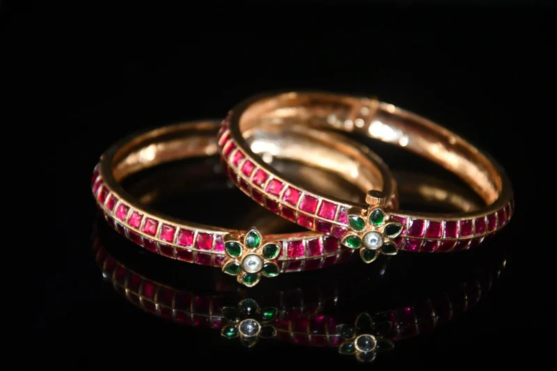 Jadau Kundan 2pc bangles with gold finish and traditional stonework by nischala fashions