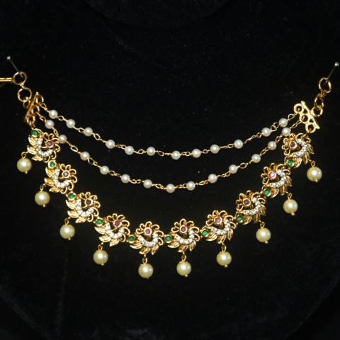 Peacock Motif Pearl Champasavaralu earchain with detailed peacock design and pearls by nischala fashions