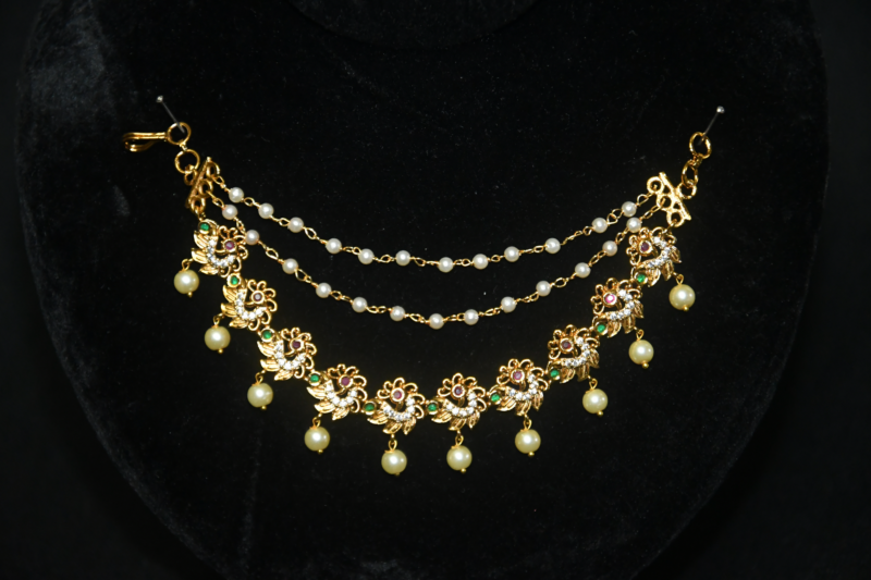 Peacock Motif Pearl Champasavaralu earchain with detailed peacock design and pearls by nischala fashions
