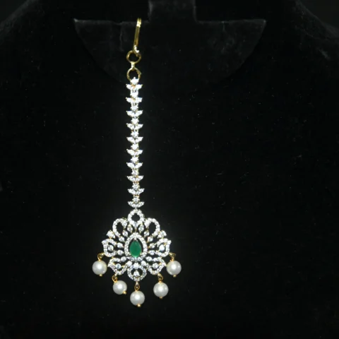 Diamond Green Maang Tikka with CZ stones and pearl hanging in traditional design by nischala fashions