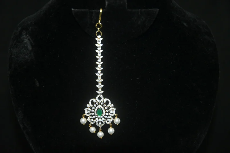Diamond Green Maang Tikka with CZ stones and pearl hanging in traditional design by nischala fashions