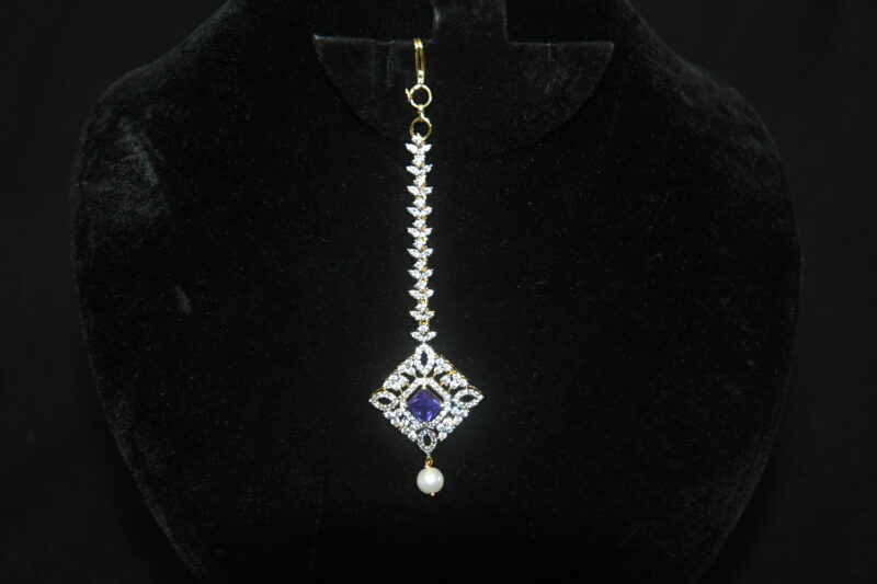 Diamond square violet maang tikka with single pearl hanging, festive Indian jewelry by Nischala Fashions.