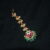 Jadau kundan flower moon maang tikka with green beads hanging, bridal statement jewelry by Nischala Fashions.