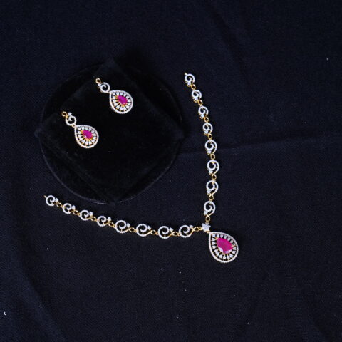 Simple diamond necklace with earrings in pink, designed with radiant diamonds and soft pink accents by Nischala Fashions.