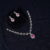 Simple diamond necklace with earrings in pink, designed with radiant diamonds and soft pink accents by Nischala Fashions.