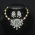 Diamond green kante necklace with earrings, traditional kante design with green stones and diamonds by Nischala Fashions.