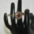 Peacock Double Finger Ring in Pink with intricate feather design and antique finish by nischala fashions