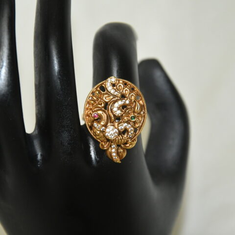 Antique Peacock Finger Ring with intricate temple design in gold finish by nischala fashions