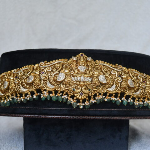 Antique grand Lakshmi cz waistbelt with green beads hanging by Nischala Fashions