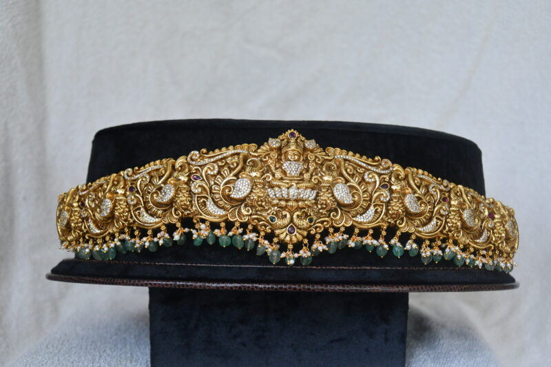 Antique grand Lakshmi cz waistbelt with green beads hanging by Nischala Fashions